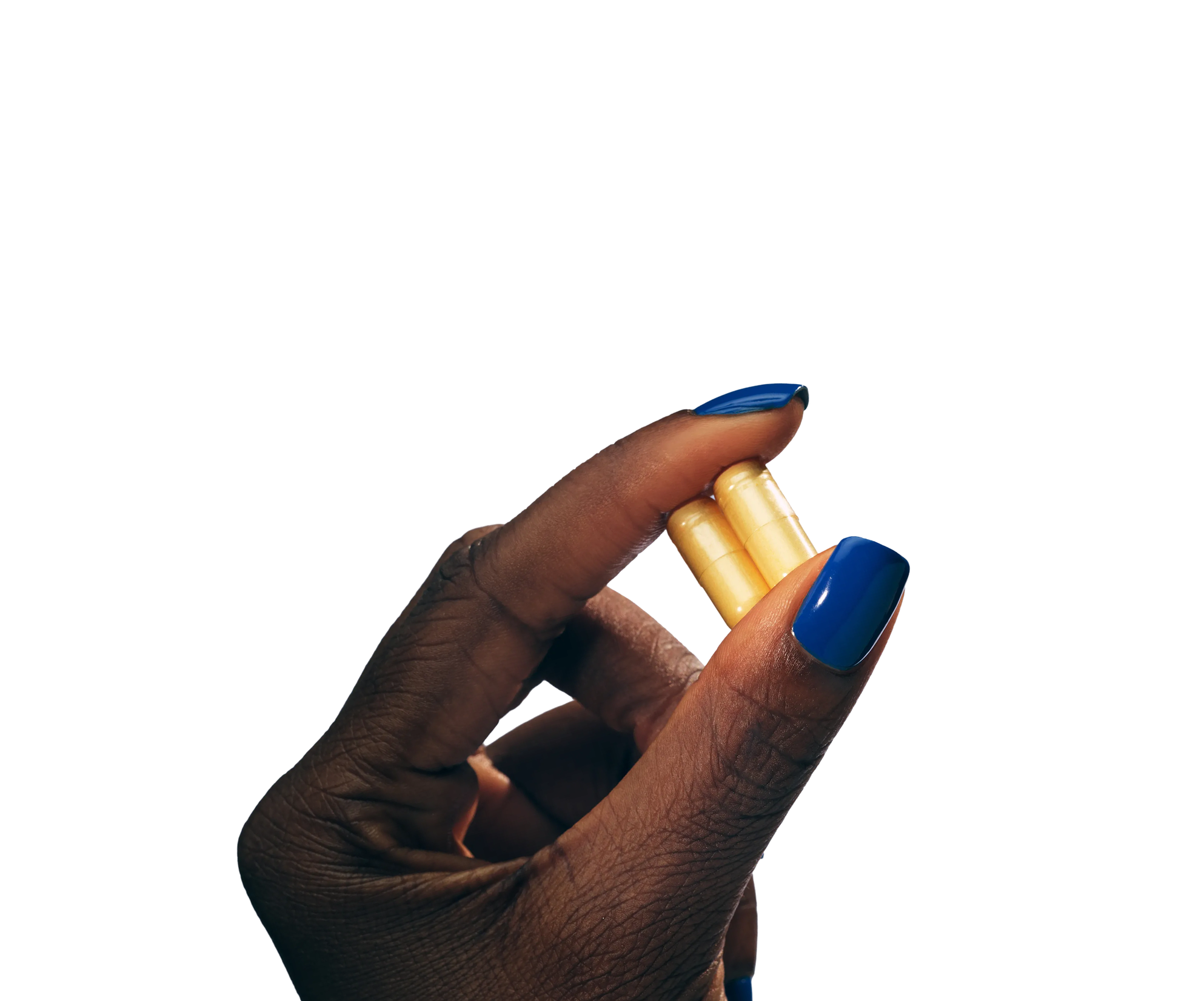 Hand holding two capsules